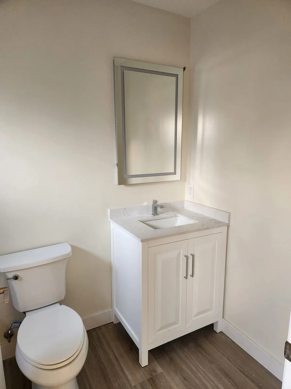 New bathroom vanity and mirror installation