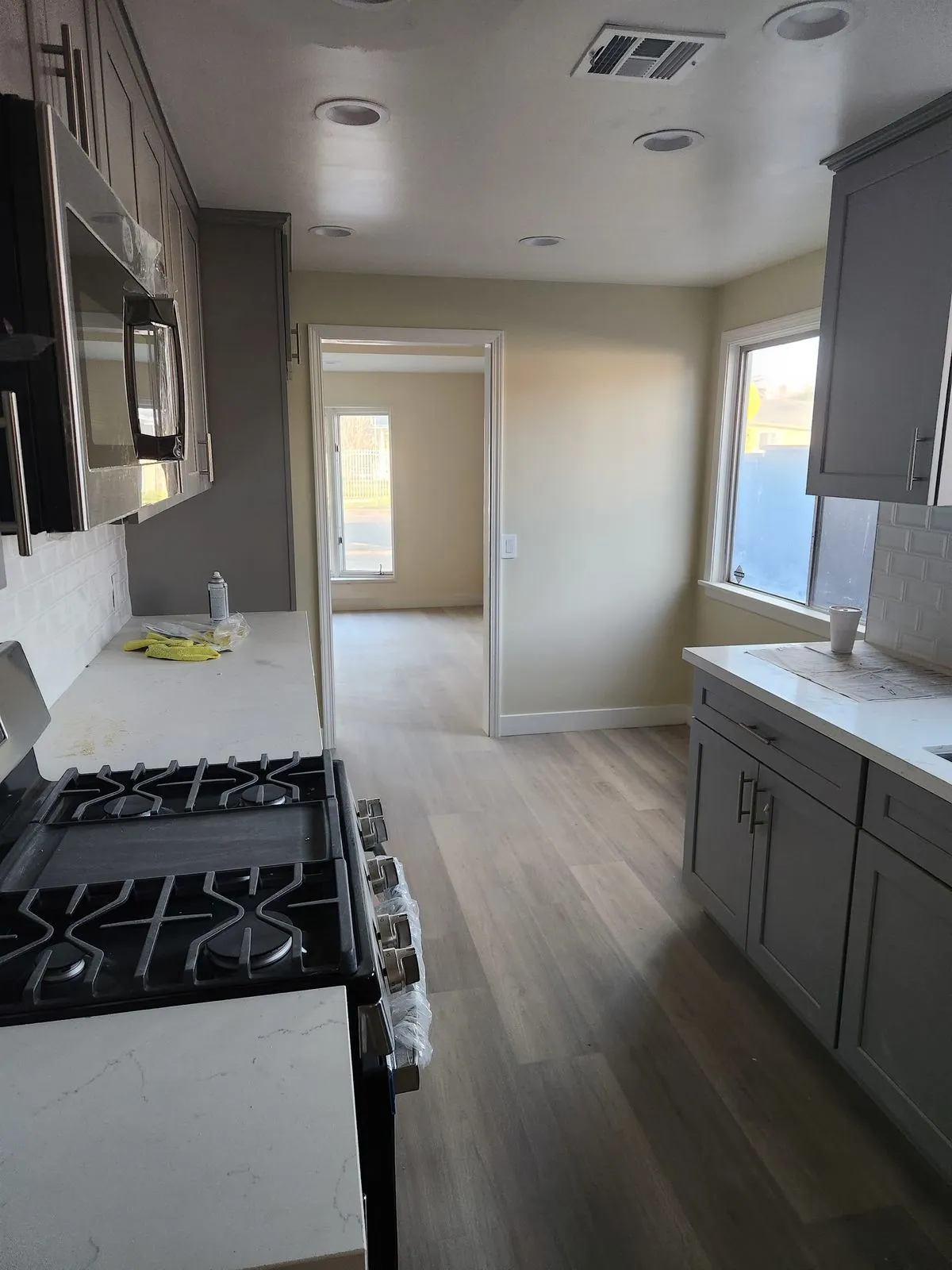 Kitchen remodel with gray cabinets and quartz countertops in Los Angeles