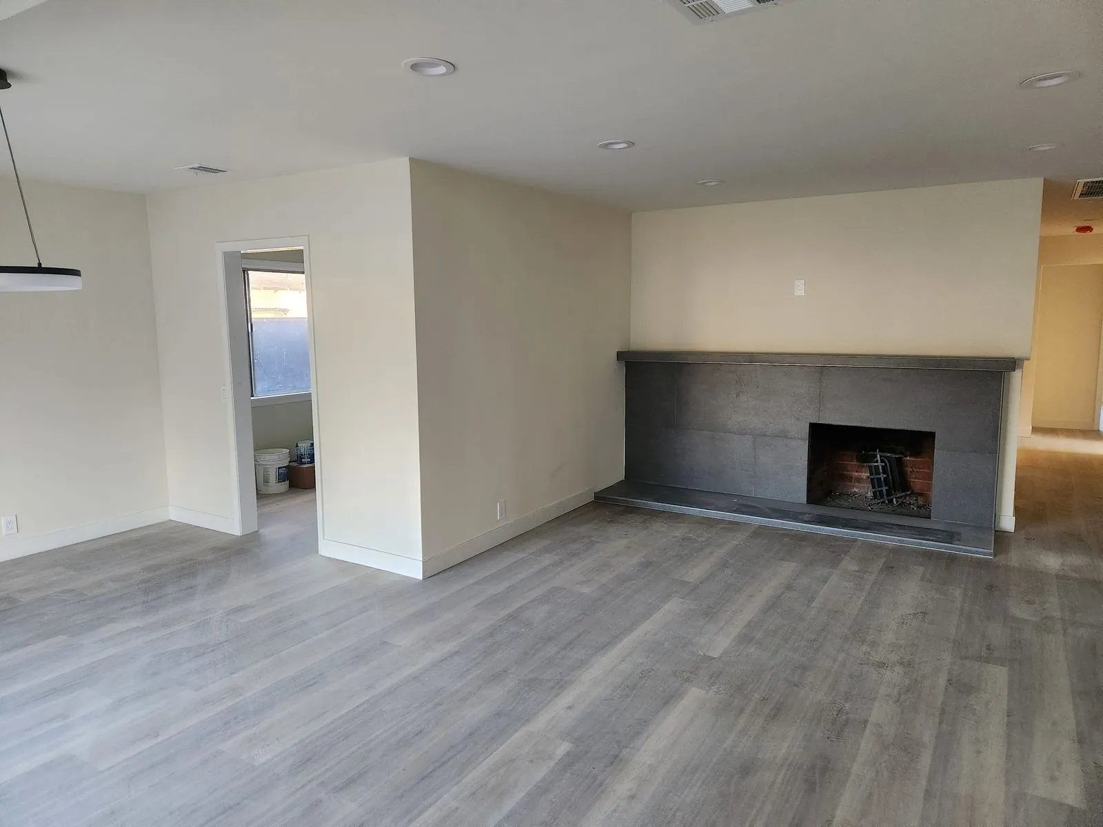 Living room with new flooring and modern fireplace