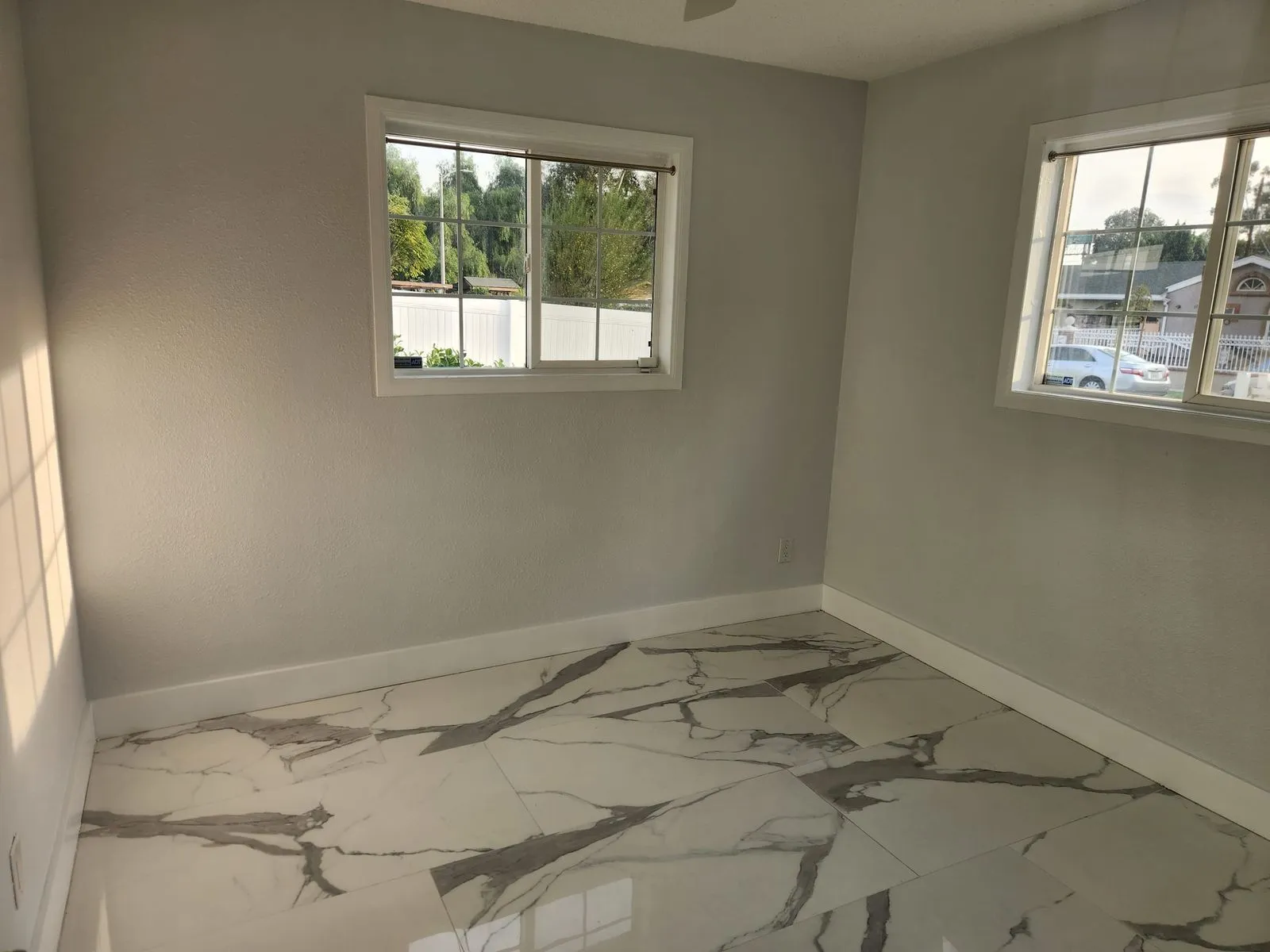 Room with marble look porcelain tile flooring